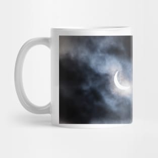 Partial solar eclipse through clouds Mug